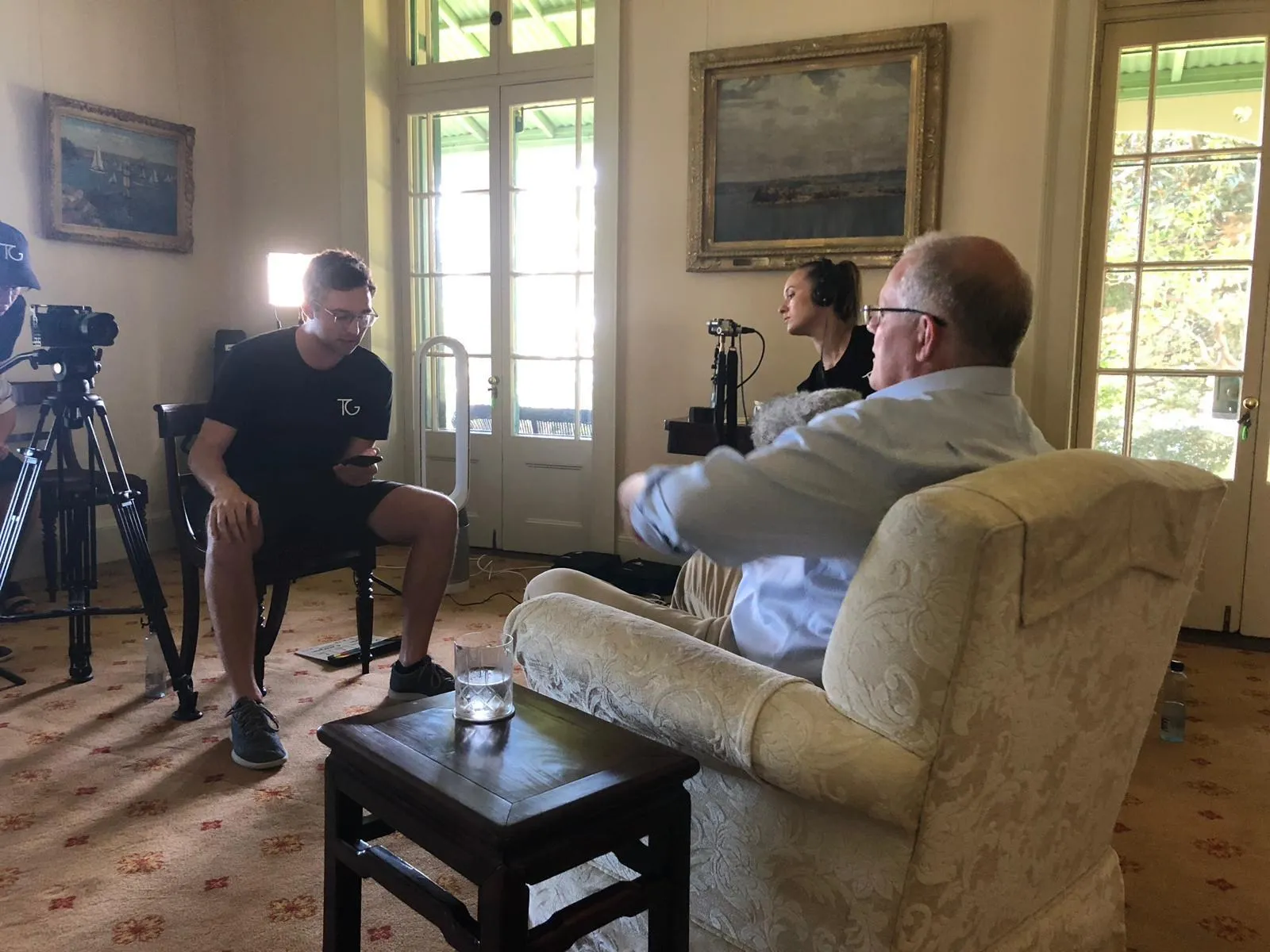 A Topham Guerin team member films a sit-down interview with former Australian prime minister Scott Morrison.