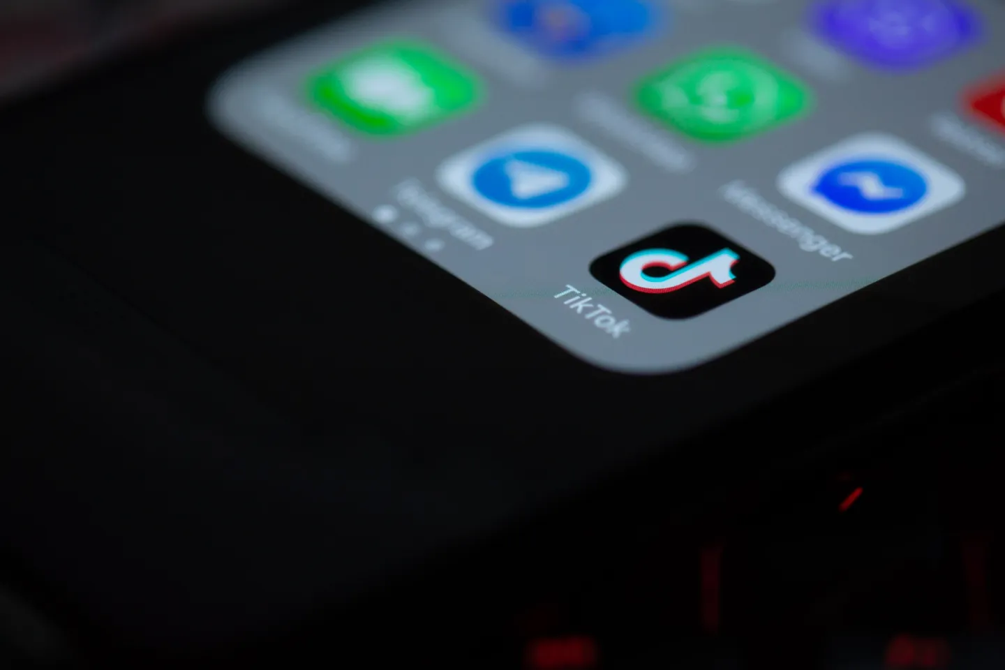 Close-up of a smartphone home screen with the TikTok app icon.