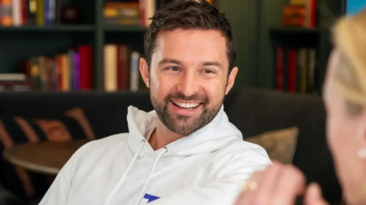 Topham Guerin co-founder Sean Topham, seated in conversation.